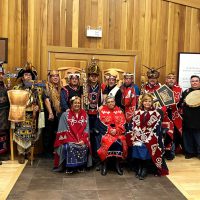 Gathering of Ligʷiłdaxʷ Hereditary Chiefs, March 4, 2025, standing united in opposition to the K’ómoks Treaty. Back from l-r: Gigamae ƛakʷasǧəm, Fred Moon, Gigamae Yakawidi, Shawn Decaire, Gigamae Udzistalis, Johnathan Henderson, Gigamae Ha̱'tła las, Dean Drake, Gigamae P’aselath, Tony Roberts Jr., Gigamae Siwiti, Jake Smith, Gigamae Tsulxid, Max Chickite, Gigamae Munmunłie, Steven Dick, Gigamae P’asslath, Gary Johnson, Gigamae Weklakalas, Jim Henderson, Gigamae Qwumqwalath, Brody Naknakim, Josiah Naknakim, Elected Chief Councillor Wei Wai Kum Chris Roberts. Front L-R: Matriarchs: Dana Roberts, Nancy Henderson, Dawn Duncan. (Image supplied by Hereditary Chiefs)